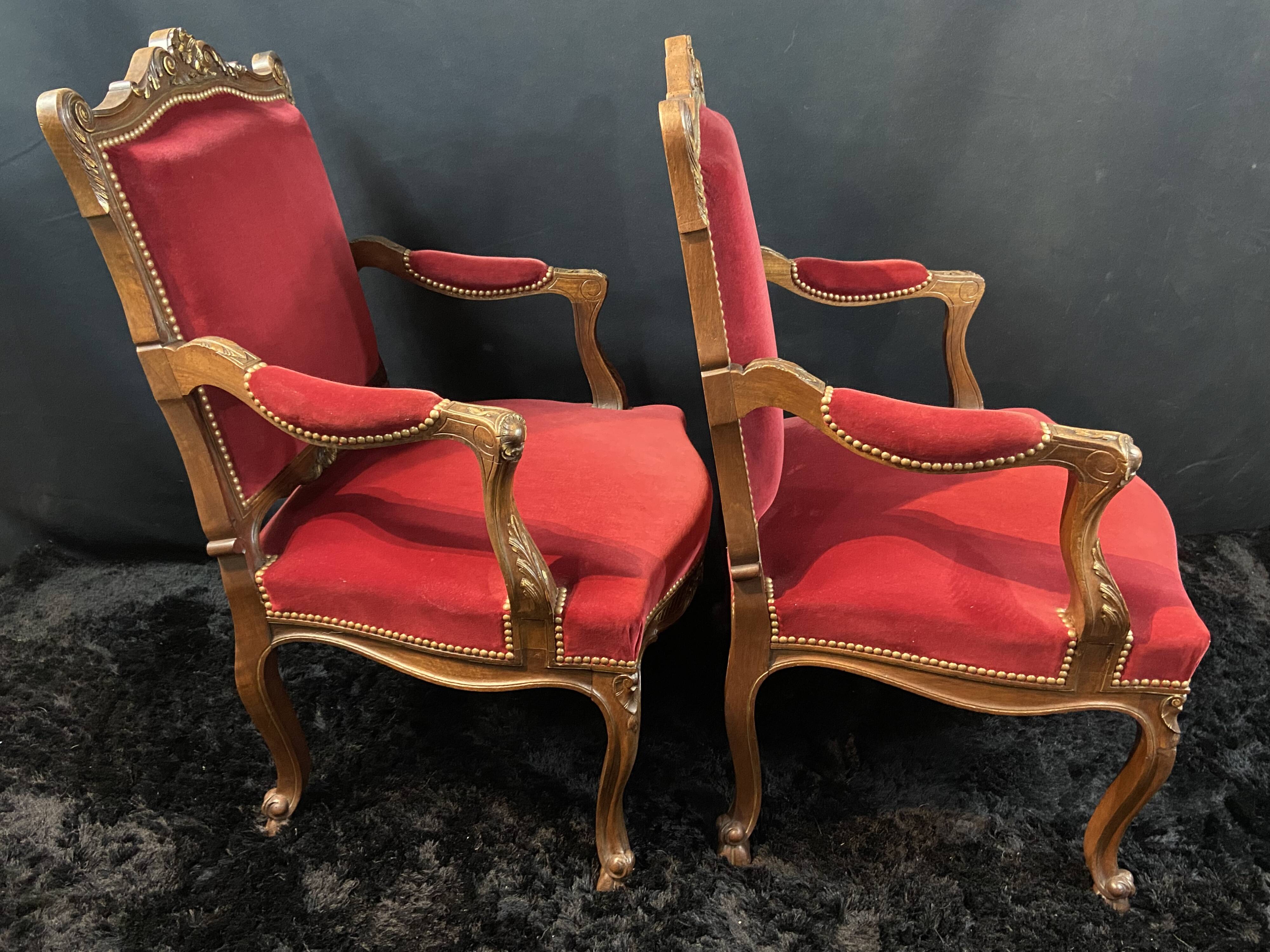 Pair of flat-back armchairs in Louis XV style in red velvet.