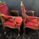 Pair of flat-back armchairs in Louis XV style in red velvet.
