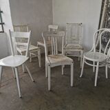 Set of 6 mismatched white chairs