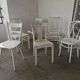 Set of 6 mismatched white chairs