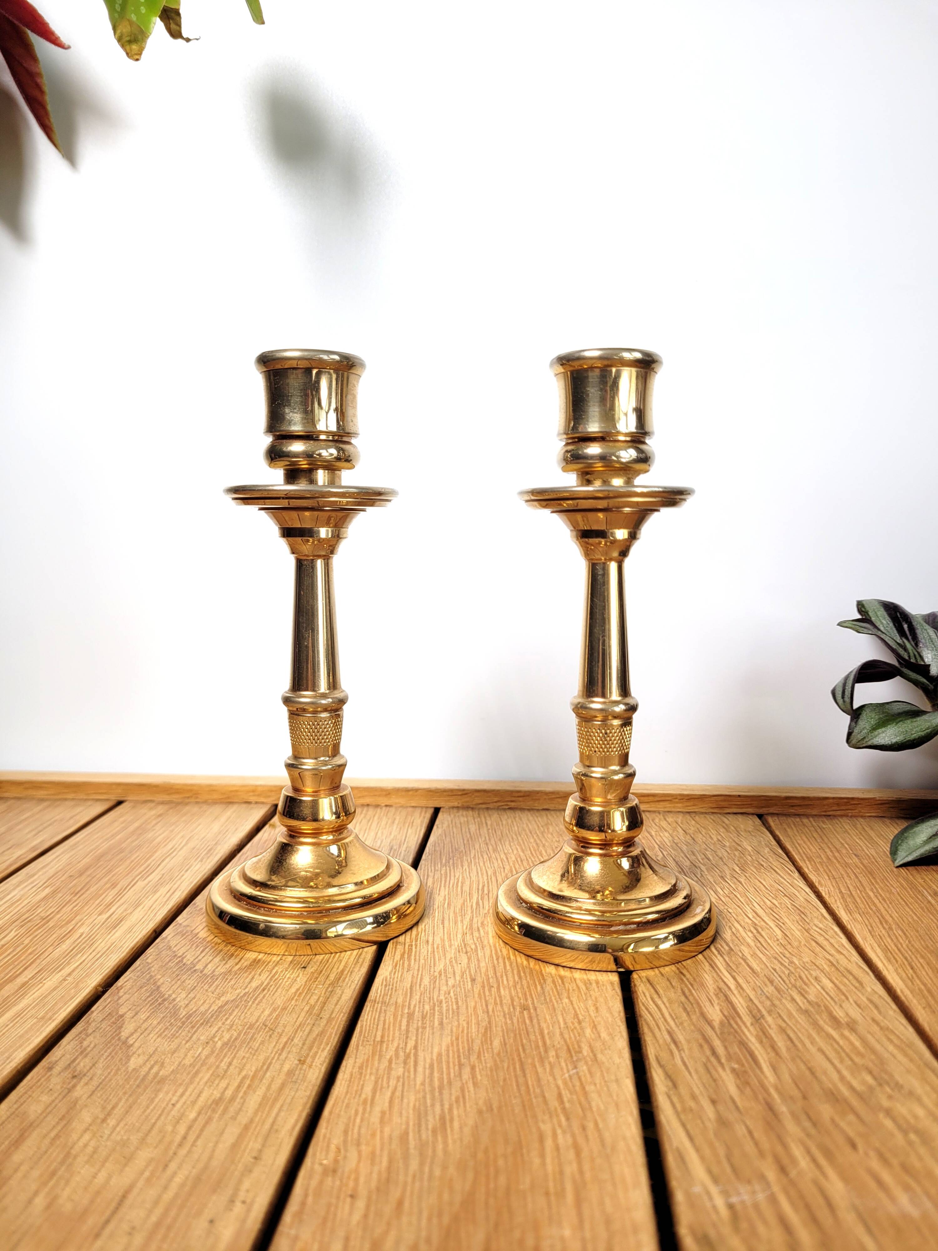 Pair of candle holders in solid gilded metal