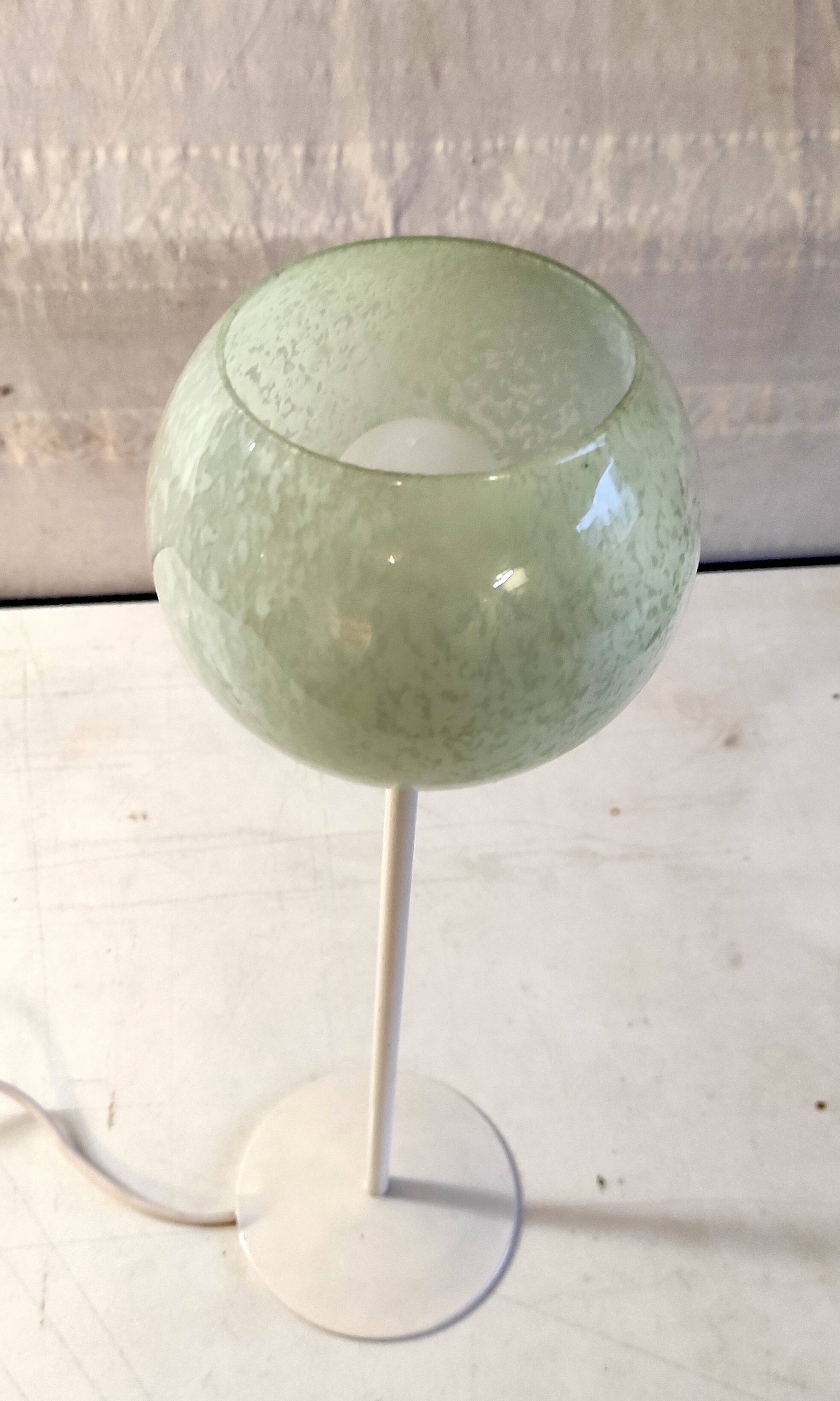 Table lamp with a pale green Clichy glass globe.
