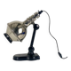 Directional articulated lamp in nickel-plated chrome and black bakelite, with cast iron counterweight.