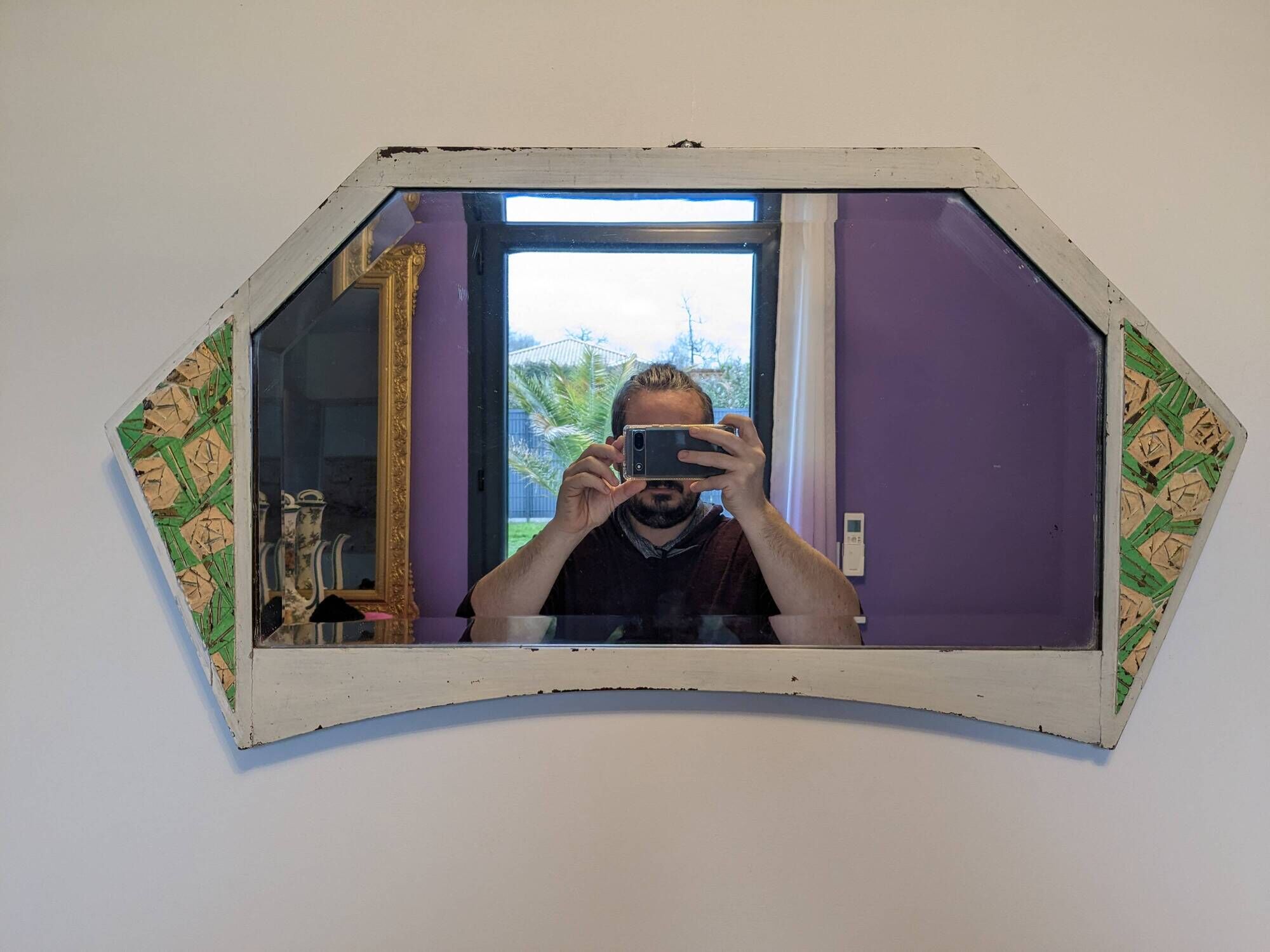Vintage geometric mirror with floral decoration – painted patinated wood – 79 cm