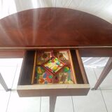 Mahogany game table and mahogany veneer, rolling half-moon console or round table.