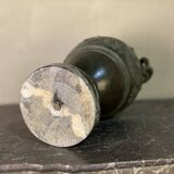 Bronze vase with snakes and a green patina, in the antique style.