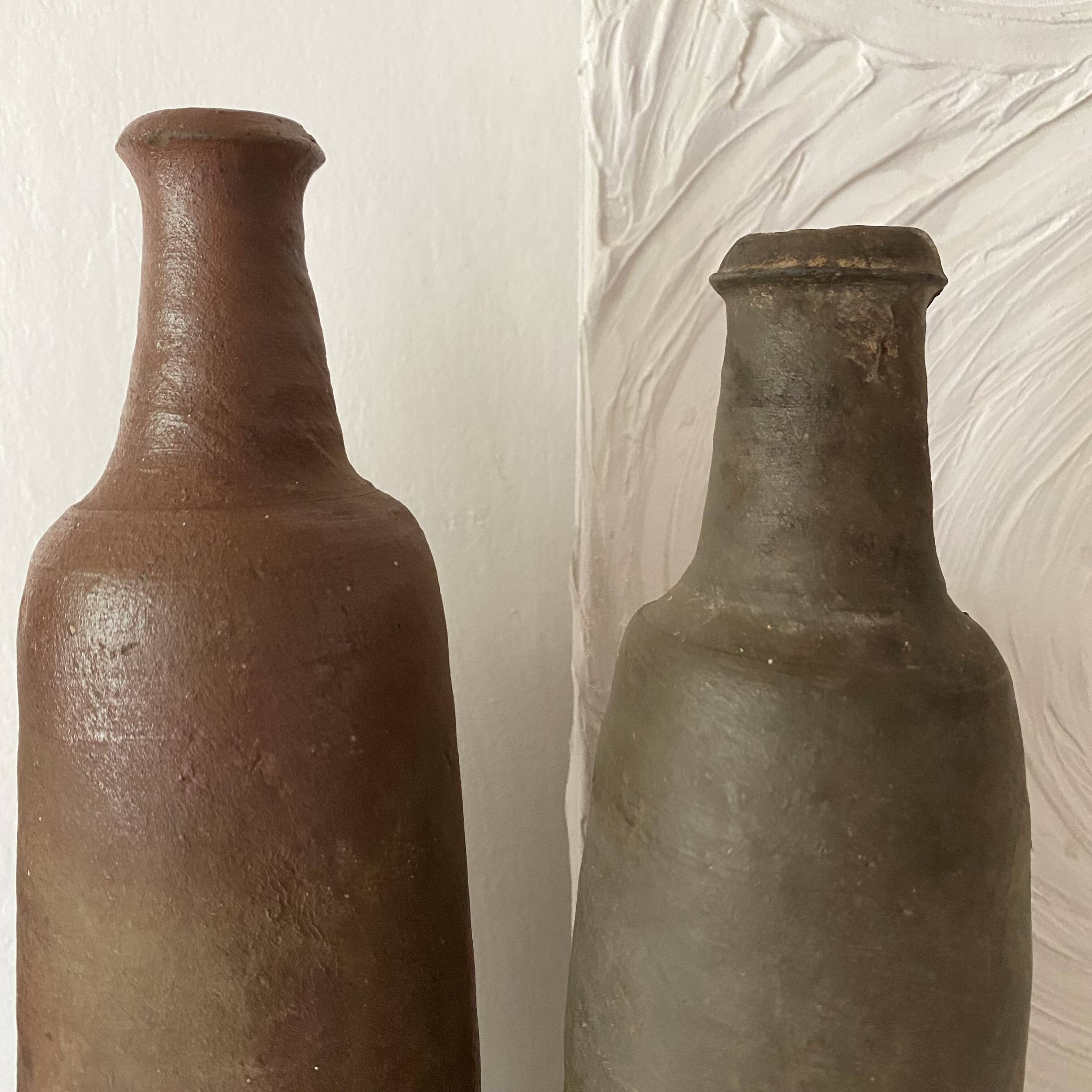Antique terracotta cider bottles