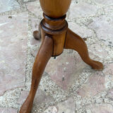 Small wooden pedestal table