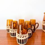 set of carafe and 6 cups in amber glass with wicker from the 70s