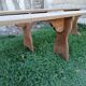Pairs of large benches in raw fir wood.