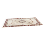 Persian rug in beige wool with woven flowers 290x190cm