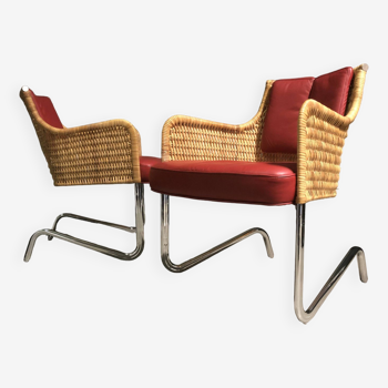pair of tecta lounge chairs.