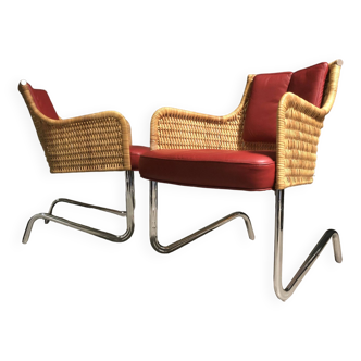 pair of tecta lounge chairs.