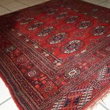 Tapis vintage fait main Tekke en laine rouge (109cm x 112cm) – Années 1970