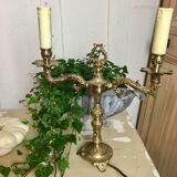 Pair of Louis XVI style double lamps in gilded bronze