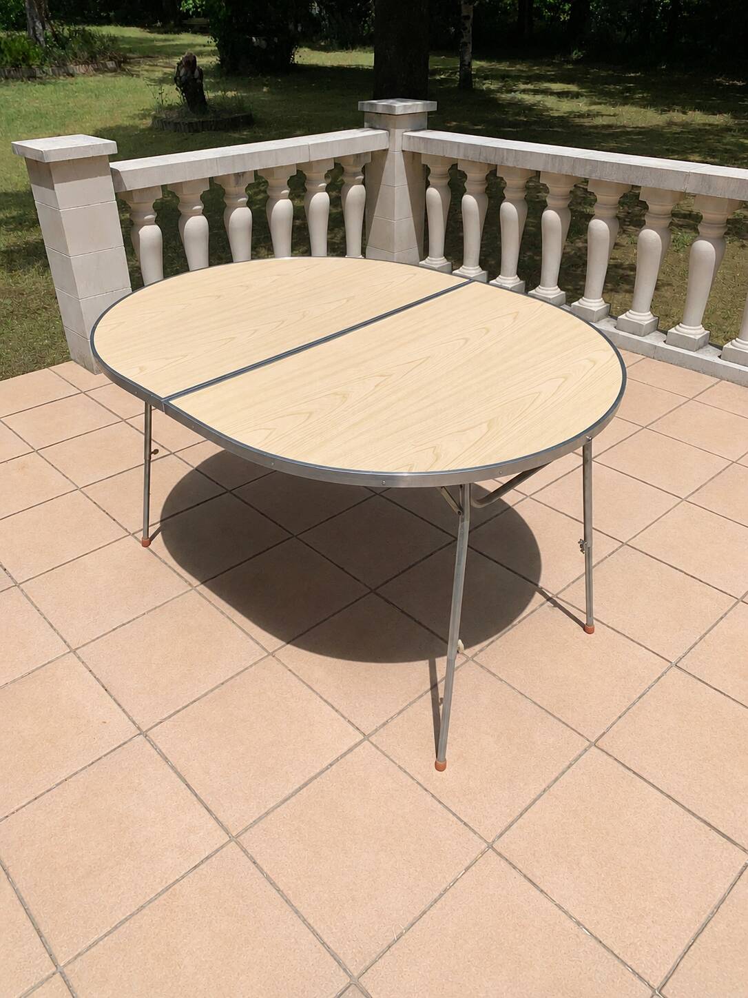 Folding oval table - height adjustable - metal and laminate - 60s/70s.