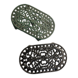 Duo of antique cast iron table mats
