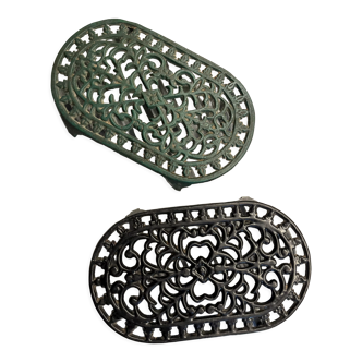 Duo of antique cast iron table mats