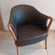 Pair of leather and wood armchairs in the style of Umberto Asnago.