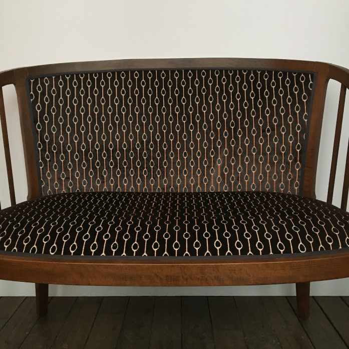 Old wooden and velvet bench