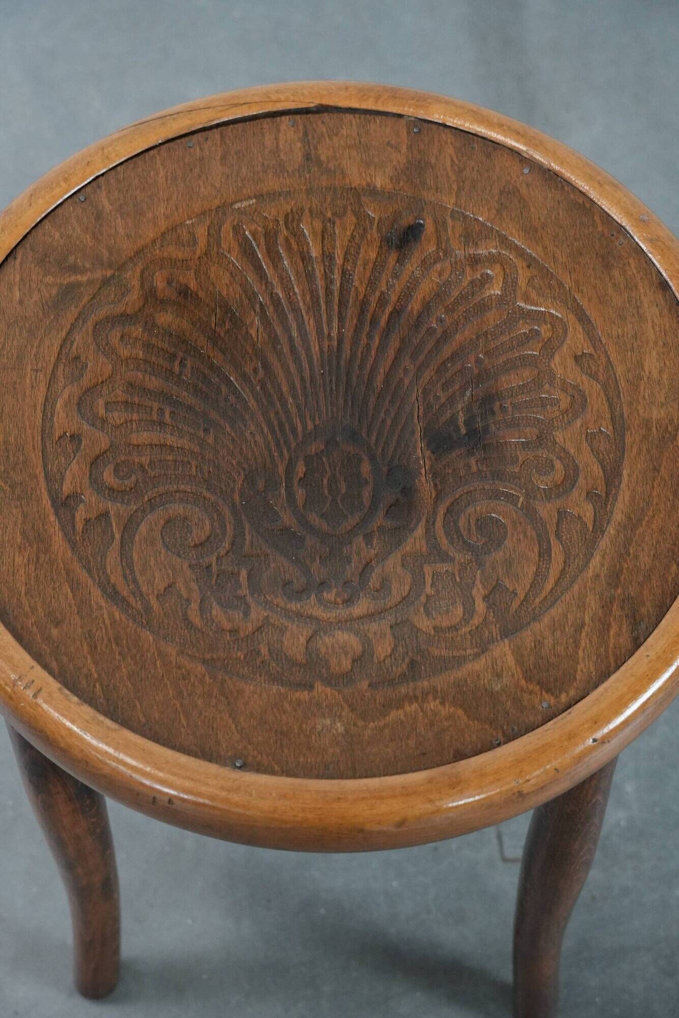 Antique bentwood stool from early 1900s with a seat with beautiful details