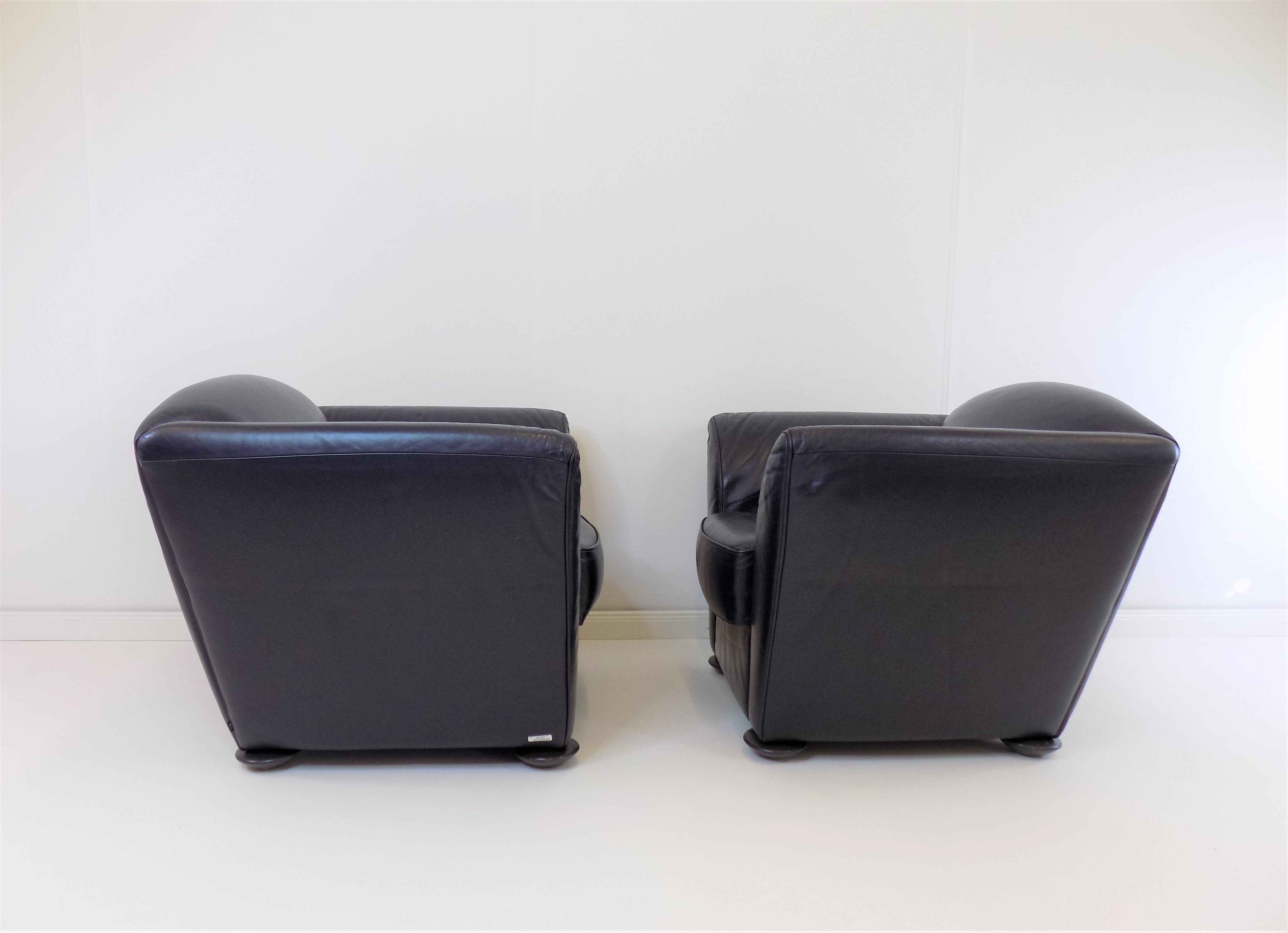 Set de 2 fauteuils en cuir par Peter Maly
