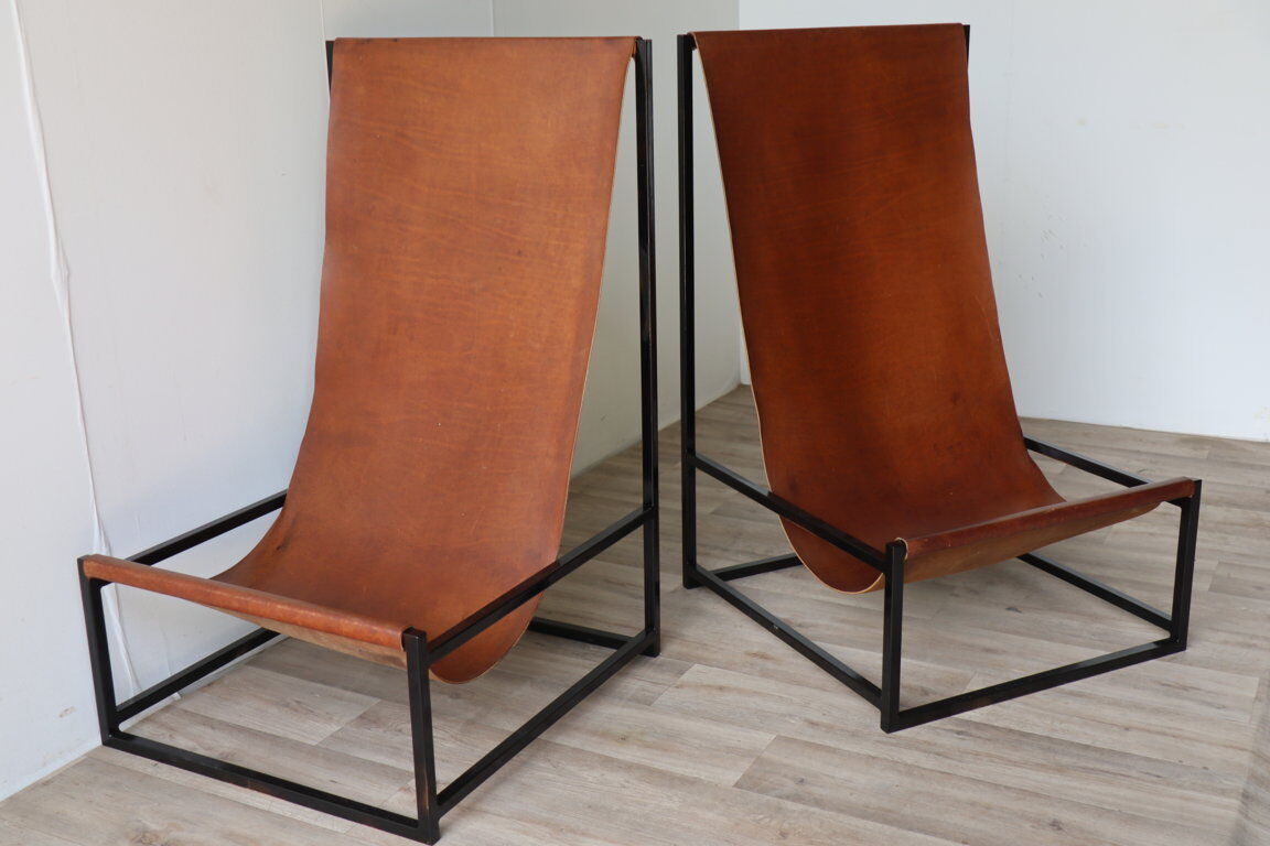 Pair of vintage armchairs in stretched leather and metal structure