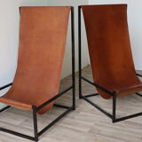 Pair of vintage armchairs in stretched leather and metal structure