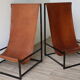 Pair of vintage armchairs in stretched leather and metal structure