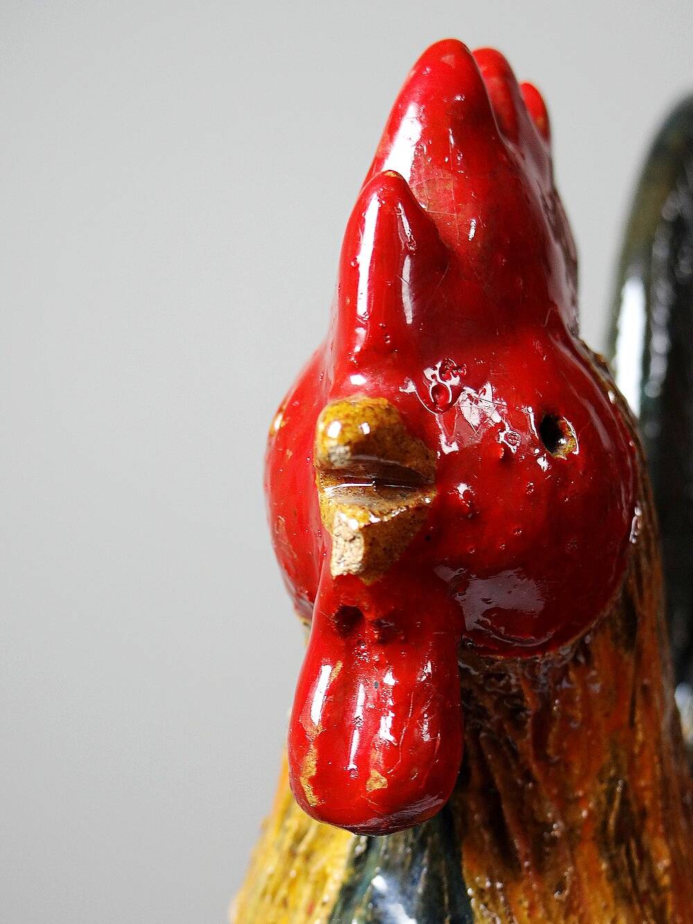 Small decorative rooster in handcrafted enameled ceramic folk art