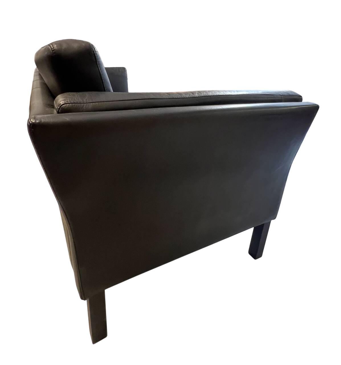 Black leather three-seater sofa