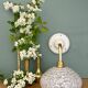 Vintage glass wall lamp with a white Clichy shade.