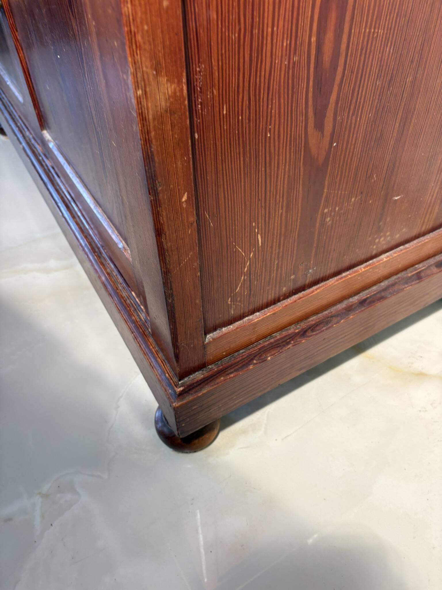 Antique wood and marble kitchen sideboard with carved backsplash