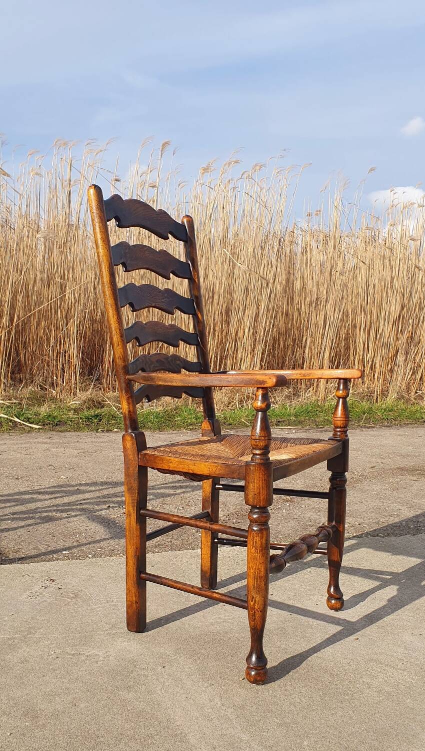 Set of 4 rustic vintage armchairs in English farmhouse style with rush seats.