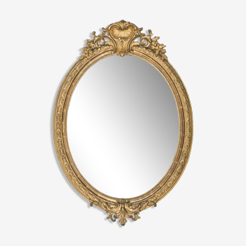 19th c gilt wood oval mirror with shell crest