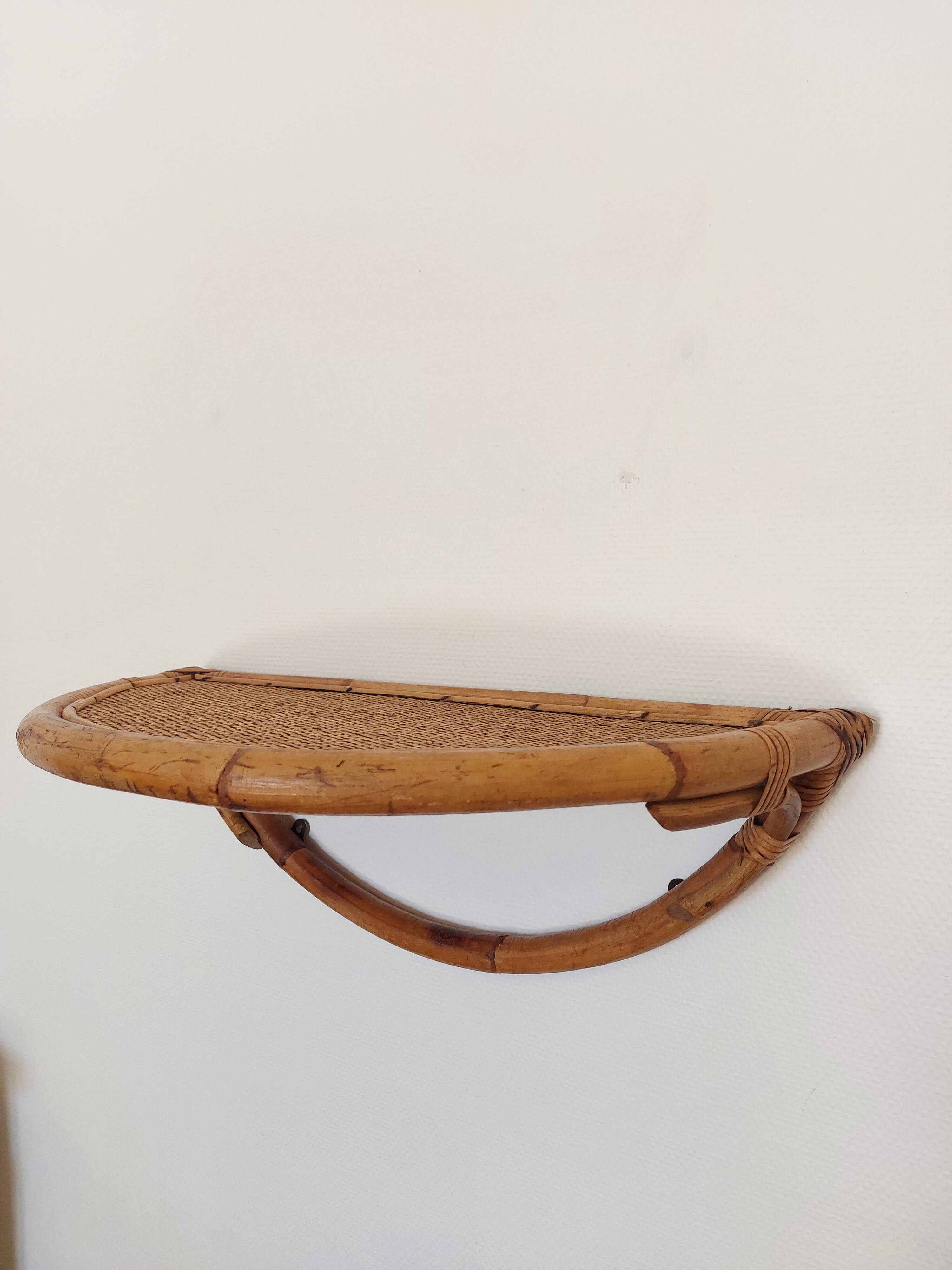 Vintage half-moon rattan shelf