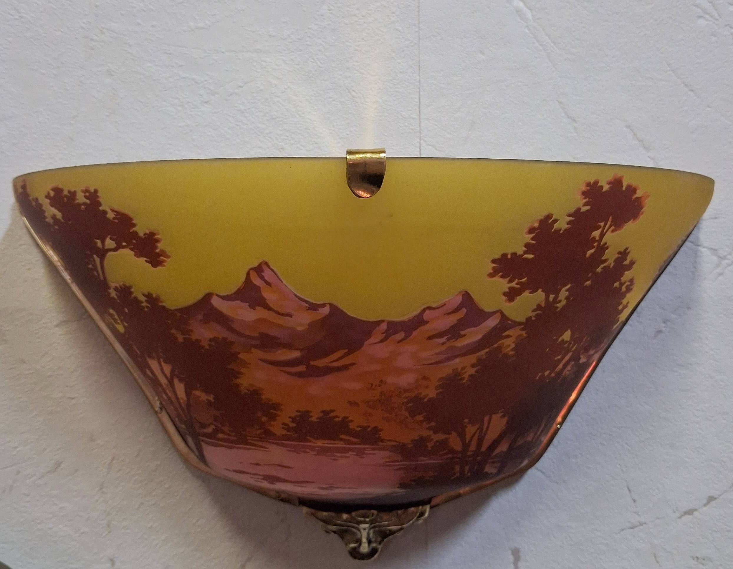 Pair of decorative wall sconces in Art Nouveau style.