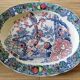 Oval Japanese plate with peacock decoration.