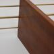 String shelf in teak and gold metal