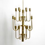 Three staged 18 arm Mid Century brass chandelier with a long brass rod