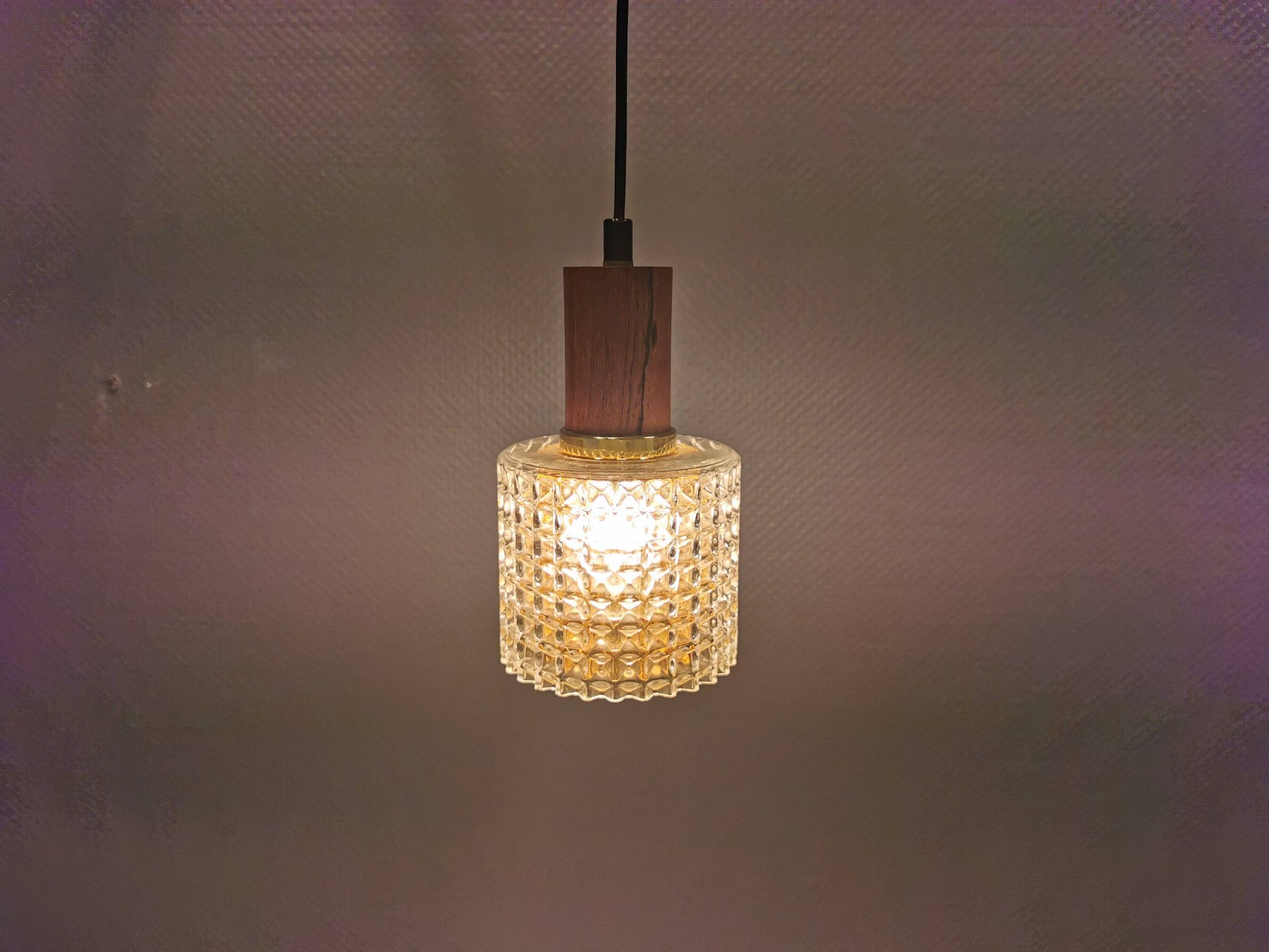 Older Swedish hanging lamp in multi-layered crystal glass with rosewood top and brass ring.