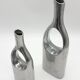Pair of "drop" vases in aluminium cast, Italy, 1970s