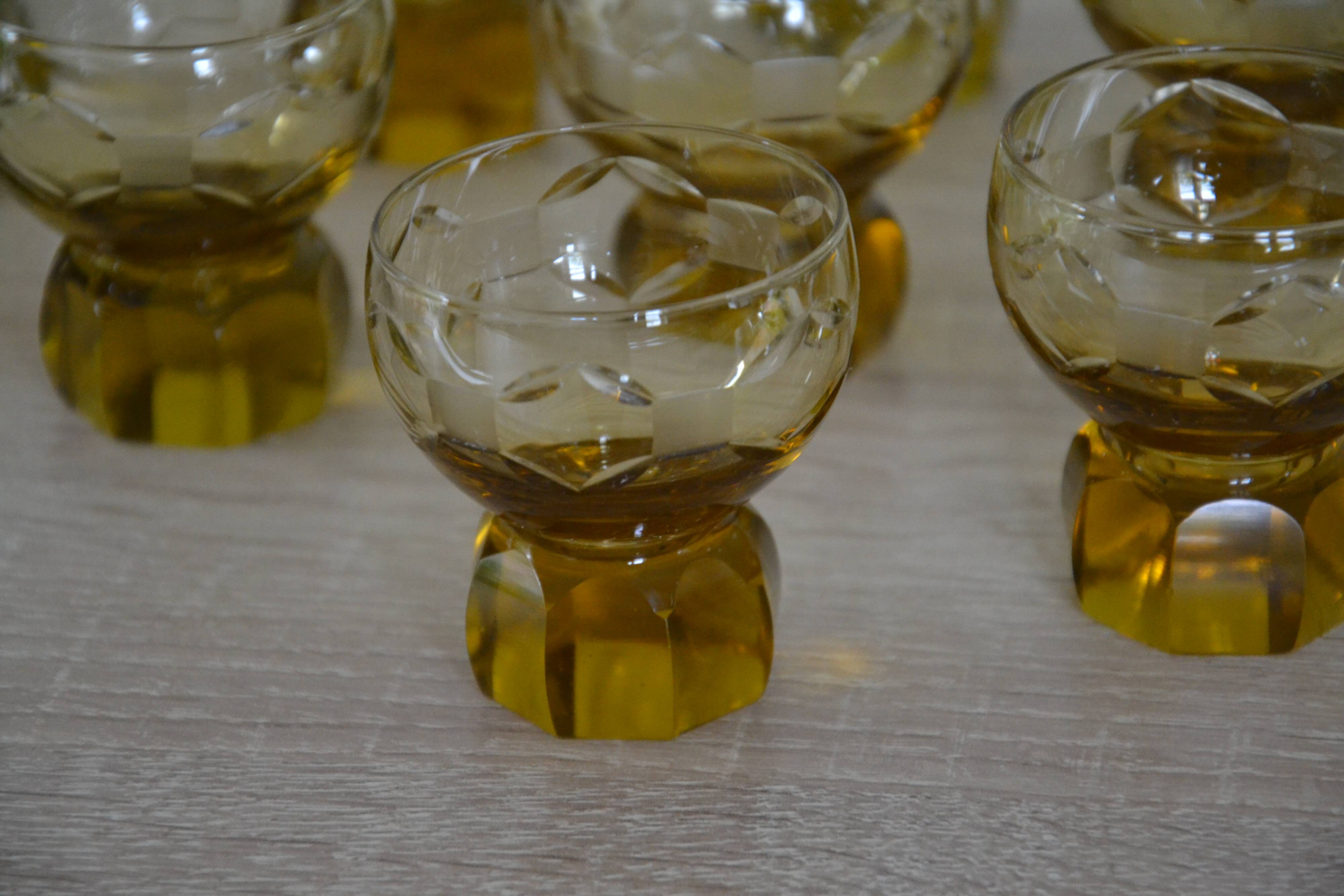 9 small amber art deco glasses