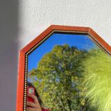 Octagonal beaded wooden mirror