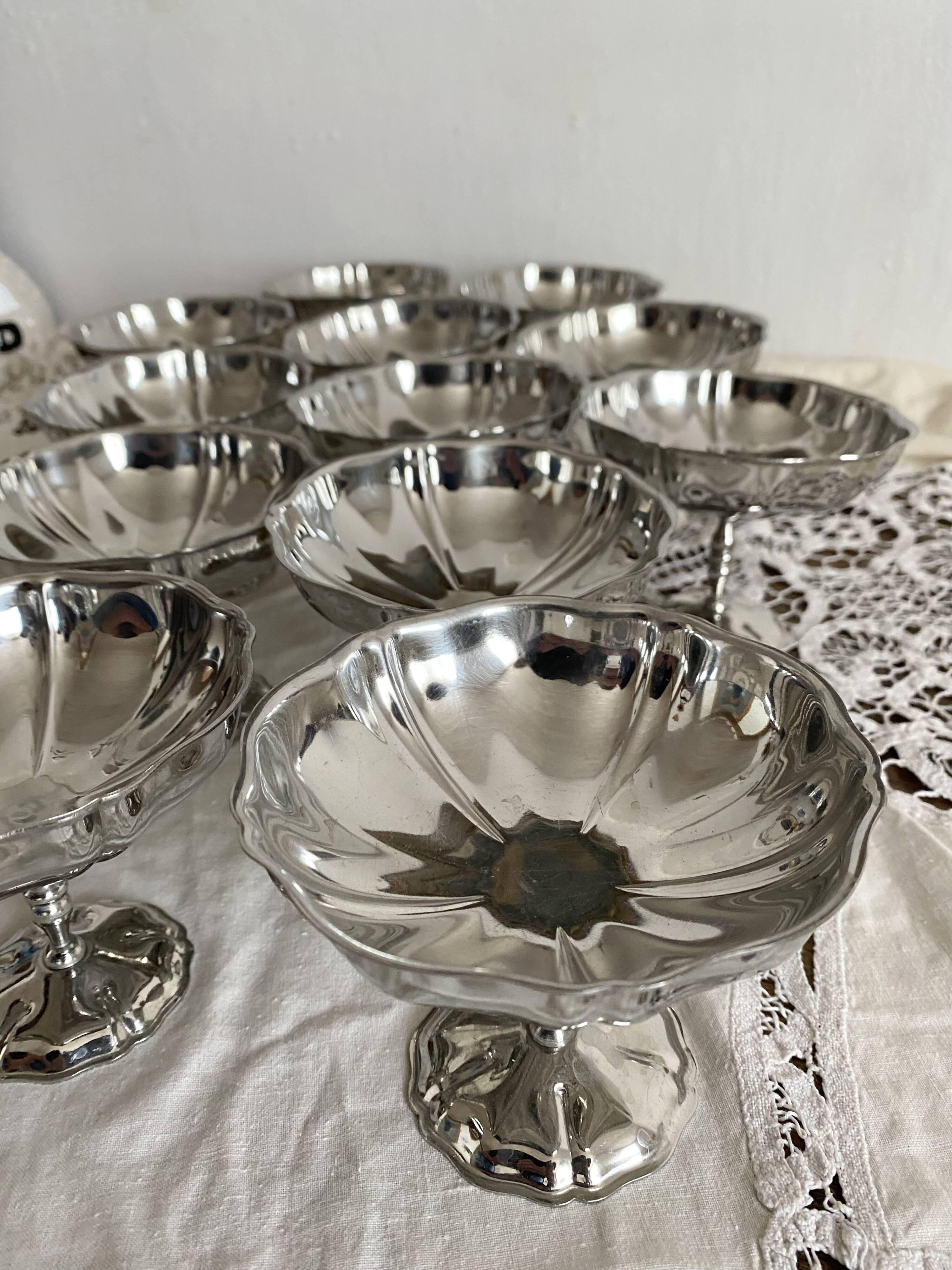 Vintage stainless steel cups on foot