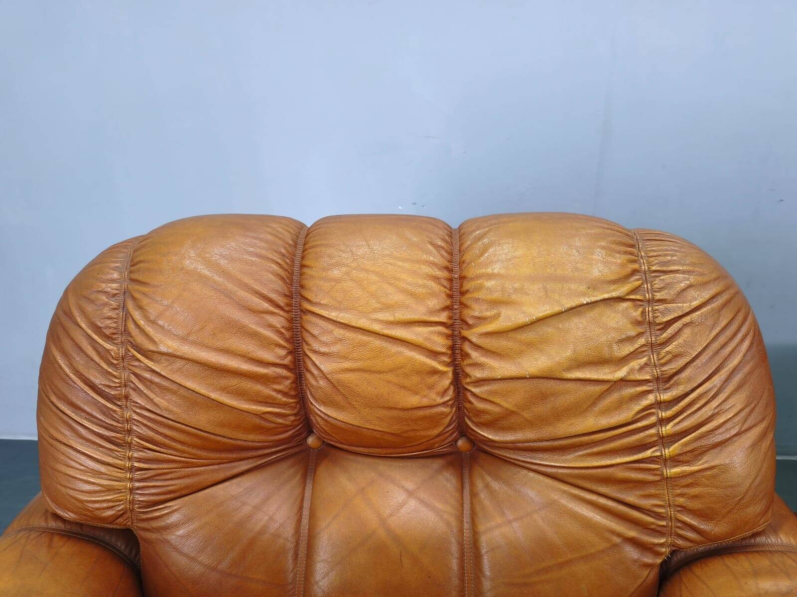 Pair of modern Italian armchairs from the mid-20th century, cognac leather, 1970.