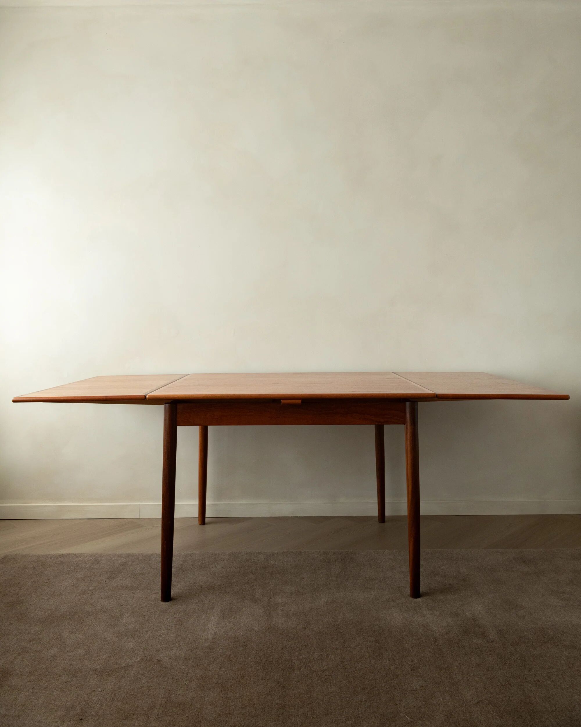 Danish modern teak extendable dining table model 24 by Ansager Møbler 1960s