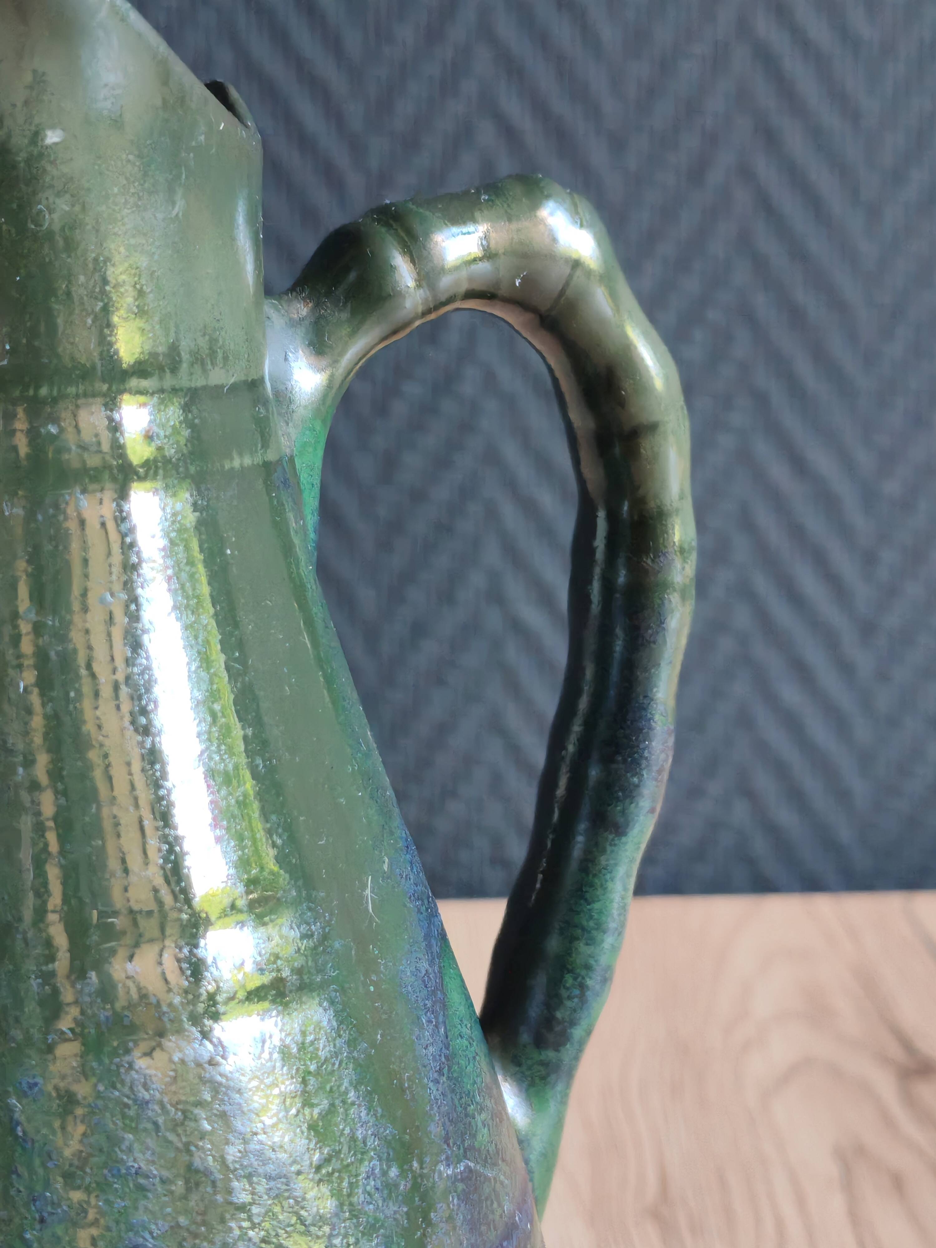 Vintage ceramic pitcher vase in glazed green and blue.