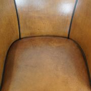 Set of 2 sheep leather club chairs finished with black piping
