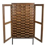 Glass filing cabinet with 125 drawers